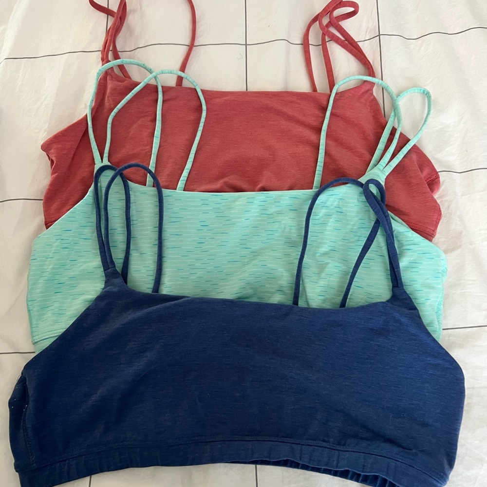 3 GapFit XL bandeau sports bras with double straps in blue, teal, and dusty pink